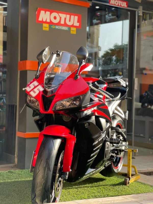 The Honda CBR 600RR 2007 is a supersport motorcycle known for its sharp handling, high performance, and race-inspired design. It is powered by a 599cc liquid-cooled, inline-four engine producing around 118 horsepower, paired with a six-speed transmission. The bike features advanced suspension, dual front disc brakes, lightweight aluminum frame, and aerodynamic bodywork inspired by Honda’s MotoGP bikes. With a fuel tank capacity of 18 liters, it offers both track performance and daily usability.